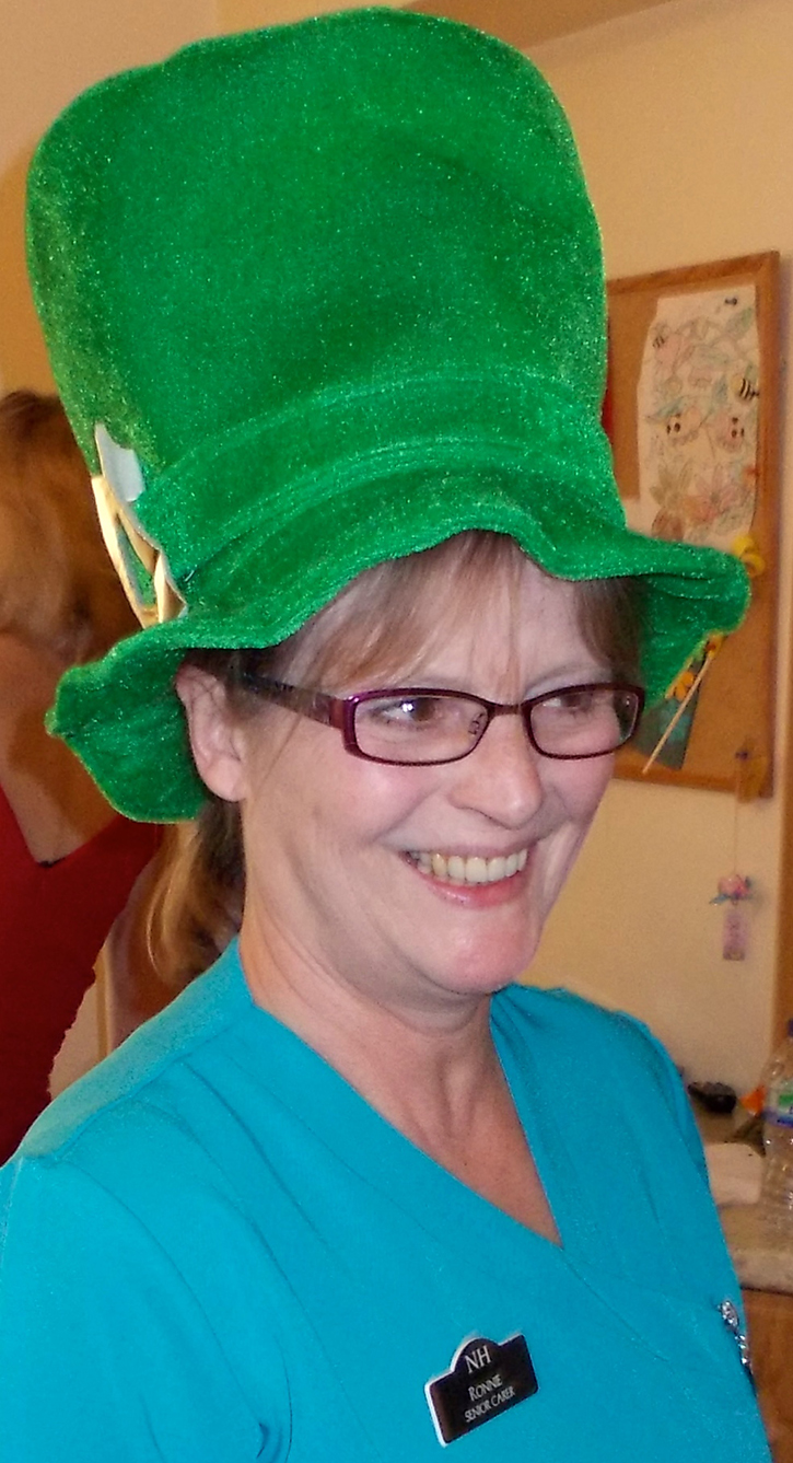 Photo of a lady with green hat